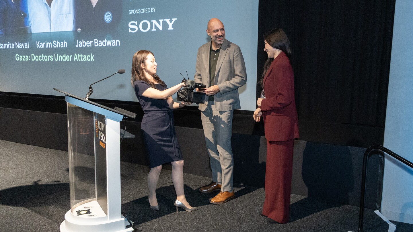 Sony's Hitomi Hamaba presenting the Sony Impact Award winners with their new Sony Z300 camera